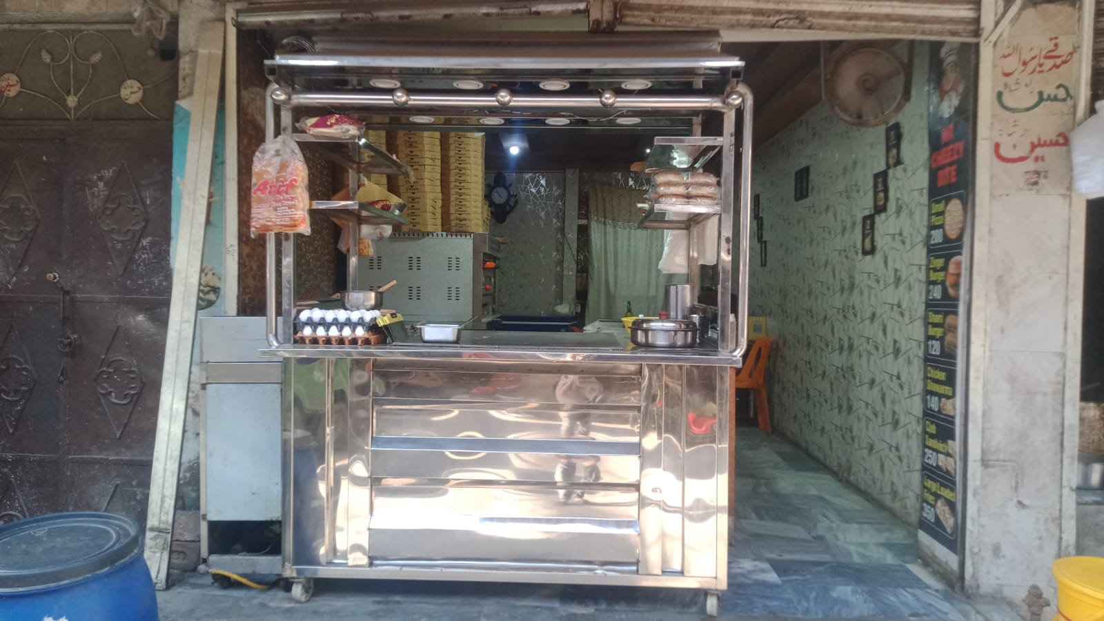 Stainless steel service counter at the shop entrance