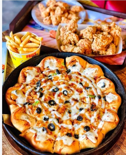 Crown crust pizza with fries and fried chicken